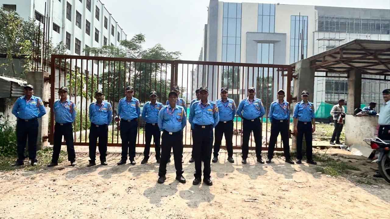 Security team lineup at industrial complex gate